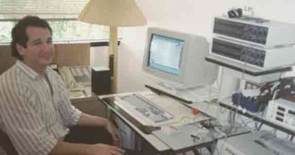 Dr. Robert Fels, biofeedback therapist in his office in Boca Raton, 1989. He is sitting with instruments that monitor several channels of physiological activity. These include Electromyography, Skin Conductance Level, Skin Temperature, Electroencephalography, Heart Rate and Blood Pressure.